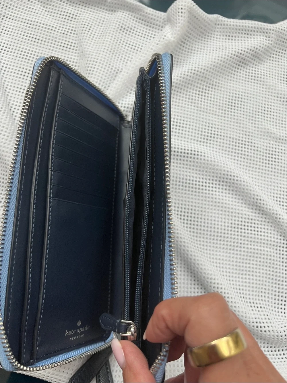 kate spade navy zip-around leather wallet with blue trim